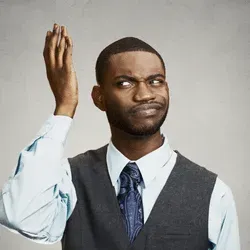 Man holding hand up confused