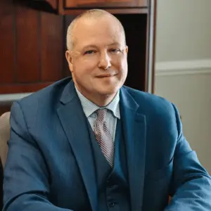 Attorney Luke Woods seated at his desk